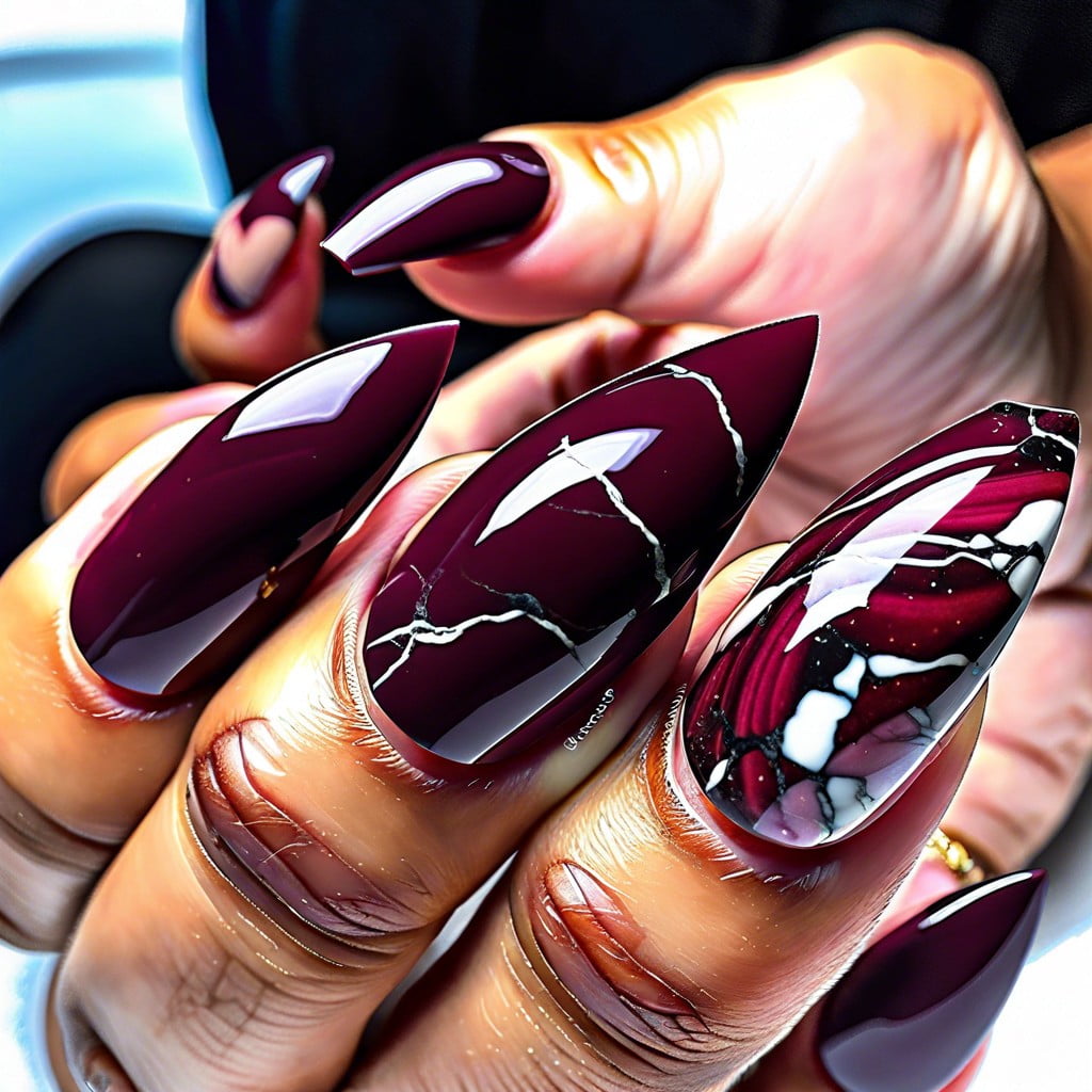 burgundy nails with a subtle maroon marble effect